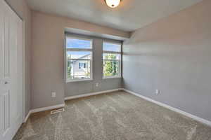 Unfurnished room with carpet flooring