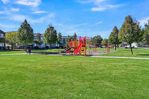 View of play area with a yard