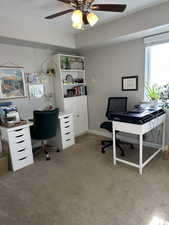 Office with carpet floors, ceiling fan, and a textured ceiling