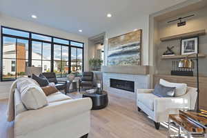 Living room featuring a fireplace and light hardwood / wood-style flooring