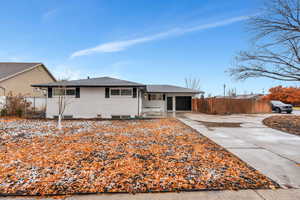 Single story home featuring a garage