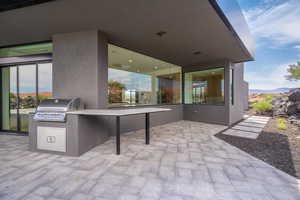 View of patio / terrace featuring a mountain view, area for grilling, and grilling area