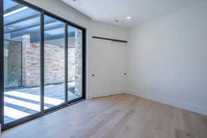 Unfurnished room with light hardwood / wood-style flooring