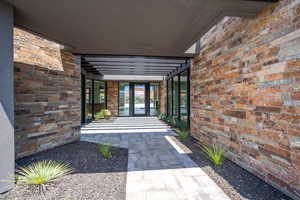 View of exterior entry featuring french doors