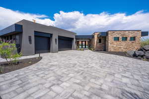 View of front facade featuring a garage