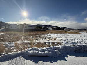 View of yard covered in snow