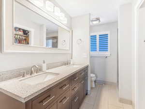 Bathroom featuring vanity and toilet