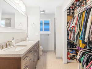 Bathroom featuring vanity and toilet