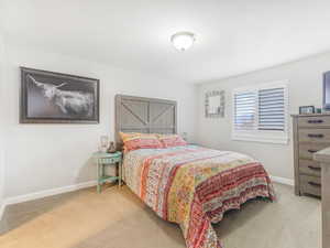 View of carpeted bedroom