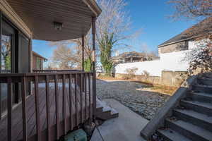 Covered deck off semi-formal dining & sunroom