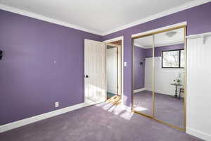 Third bedroom up with ornamental moldings & mirrored closet doors