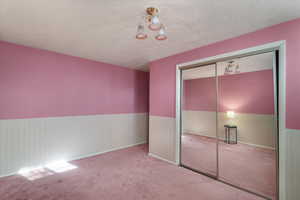 Fifth bedroom with mirrored closet doors