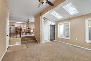 View from sunroom back to kitchen & semi-formal dining