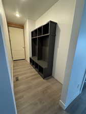 Mudroom with hardwood / wood-style flooring