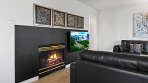 Living room with light hardwood / wood-style floors