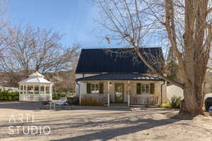 View of front facade with a gazebo and covered porch