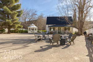 View of patio with covered porch and a gazebo