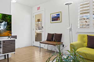 Living area with light wood-type flooring