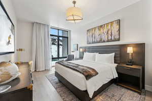 Bedroom featuring wood-type flooring