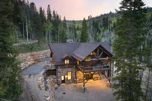 View of front of house with a wooden deck