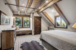 Bedroom with beam ceiling and wooden ceiling