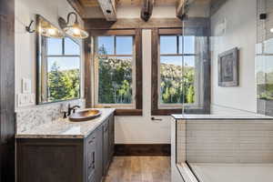 Bathroom with vanity and a wealth of natural light