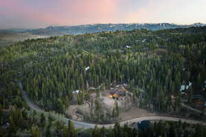 Aerial view at dusk featuring a mountain view