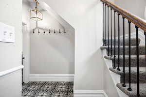 Mudroom featuring tile patterned flooring