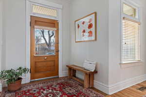 Entrance foyer featuring hardwood / wood-style flooring