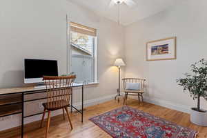 Office with ceiling fan and wood-type flooring