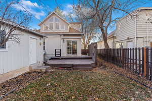 Back of property featuring a deck