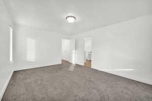 Unfurnished room with carpet floors