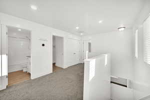 Interior space with carpet flooring and a wealth of natural light