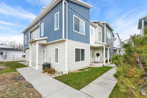 Exterior space with cooling unit and a front yard