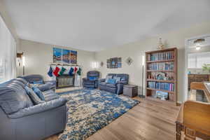 Living room featuring light hardwood / wood-style flooring and sink