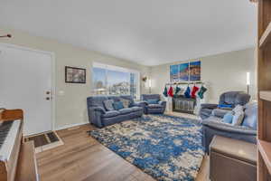 Living room with hardwood / wood-style floors