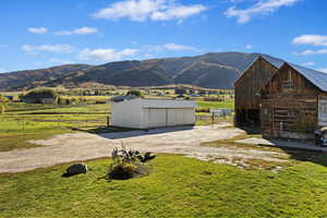 Property view of mountains with a rural view