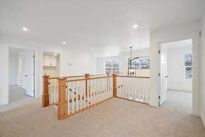 Second floor landing area with view of the loft.