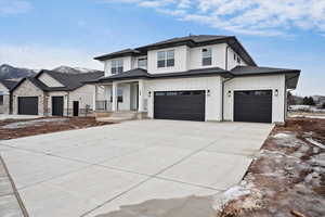 Craftsman style exterior with large front porch, 3 car garage and siding exterior.