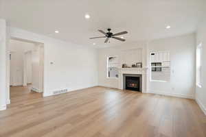 Family room with large windows and fireplace details.