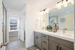 Owner's bathroom with double sink vanity.