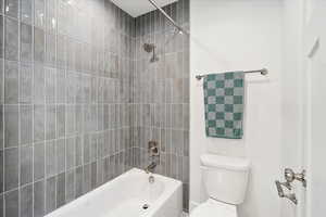 Main bathroom with shower/tub combo.