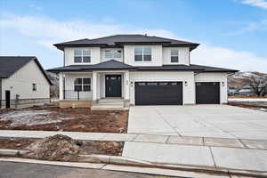 Craftsman style exterior with large front porch, 3 car garage and siding exterior.