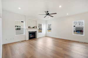 Family room with large windows and fireplace details.