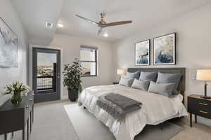 Carpeted bedroom featuring ceiling fan