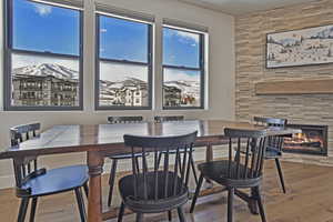 Dining area featuring hardwood / wood-style floors and a fireplace