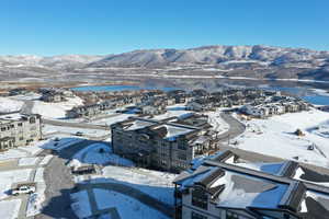 Snowy aerial view featuring a mountain view