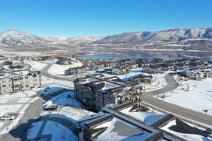 Snowy aerial view featuring a mountain view