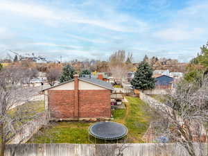 View of yard with a trampoline