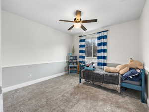 Bedroom with carpet and ceiling fan